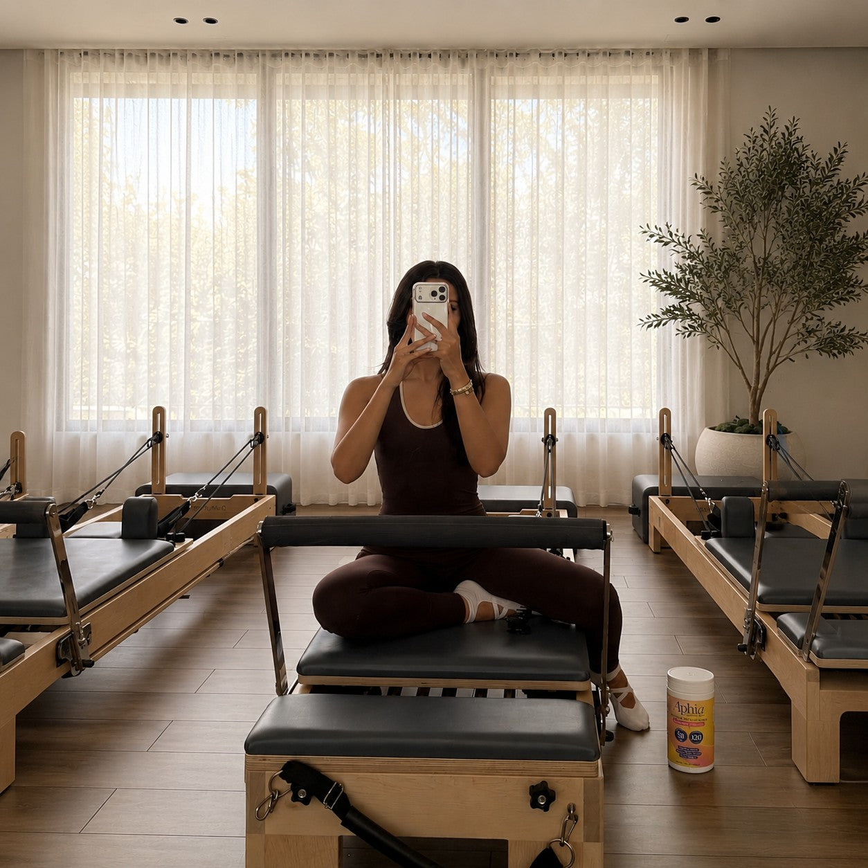 Woman taking a moment for herself at the pilates studio